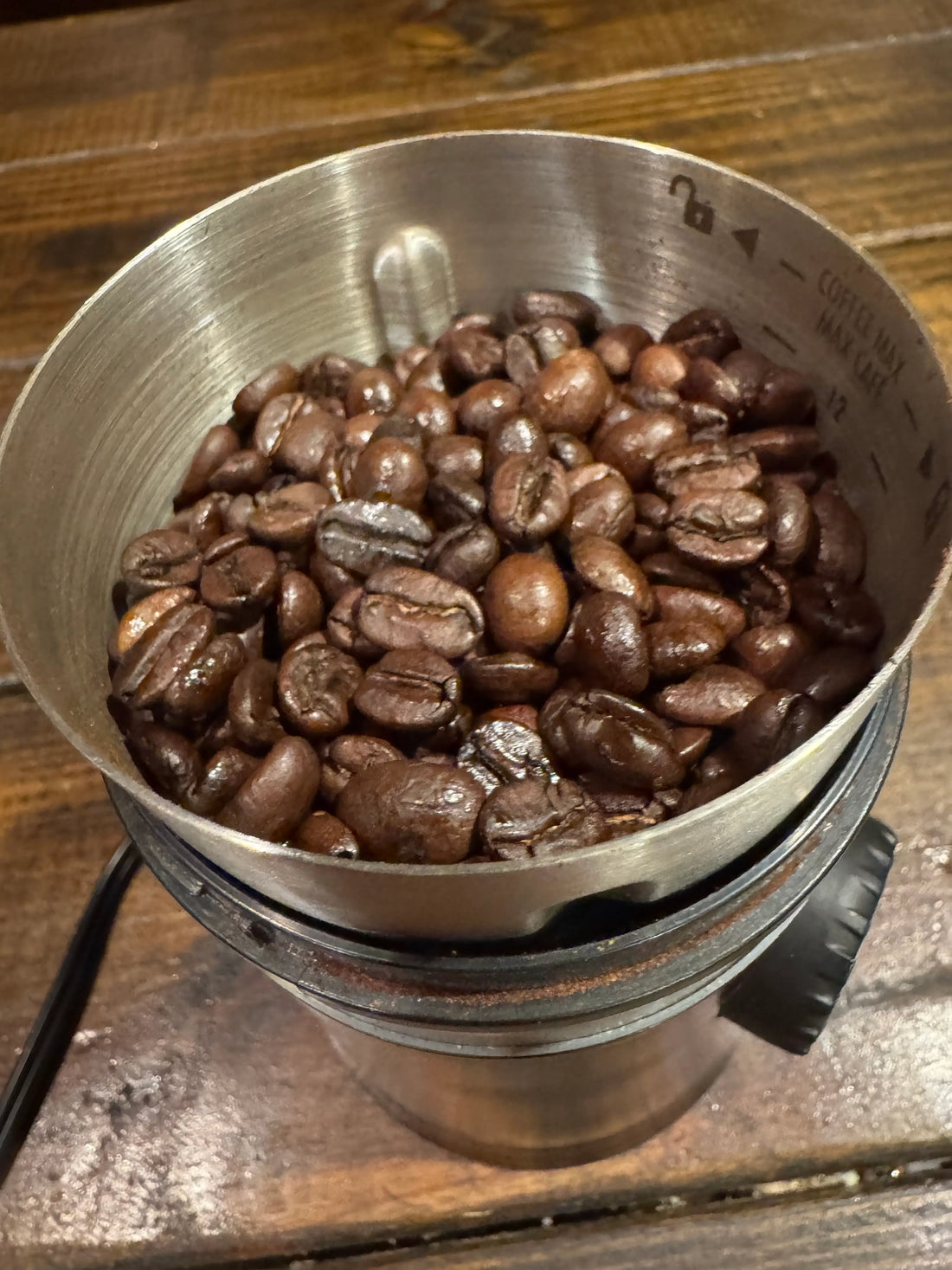 Freshly roasted coffee beans ready for grinding in a warm, mindful brewing moment